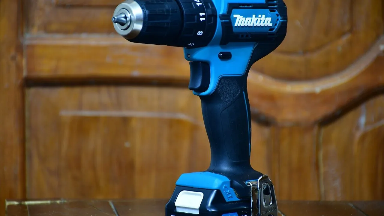 Cordless drill being used on wood in a workshop setting with clear view of the tool