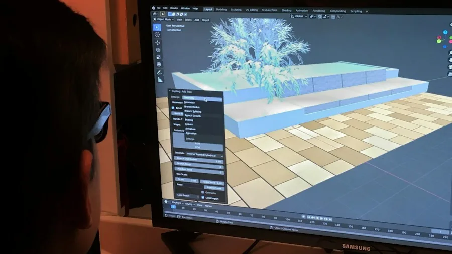 Creative professional working on 3D design software at computer workstation in modern office