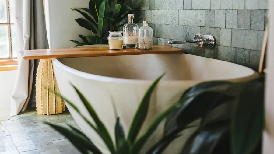 Person cleaning white bathtub with sponge and soap, focusing on thorough hygiene and maintenance
