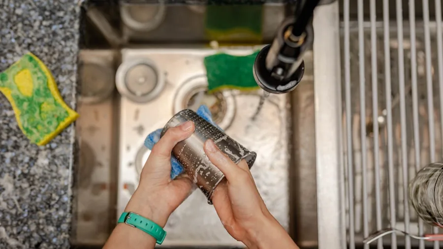 Person loading dishes into dishwasher in modern kitchen
