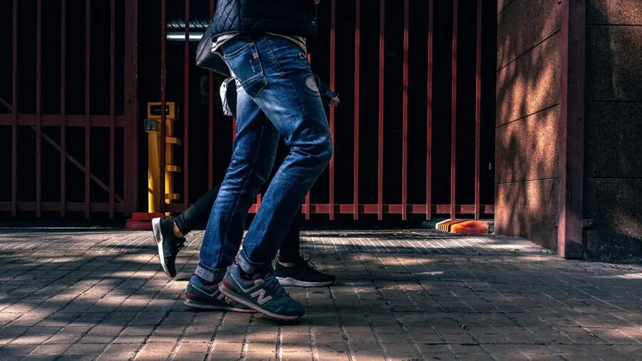 Person recording dynamic action footage with camera stabilization during outdoor activity