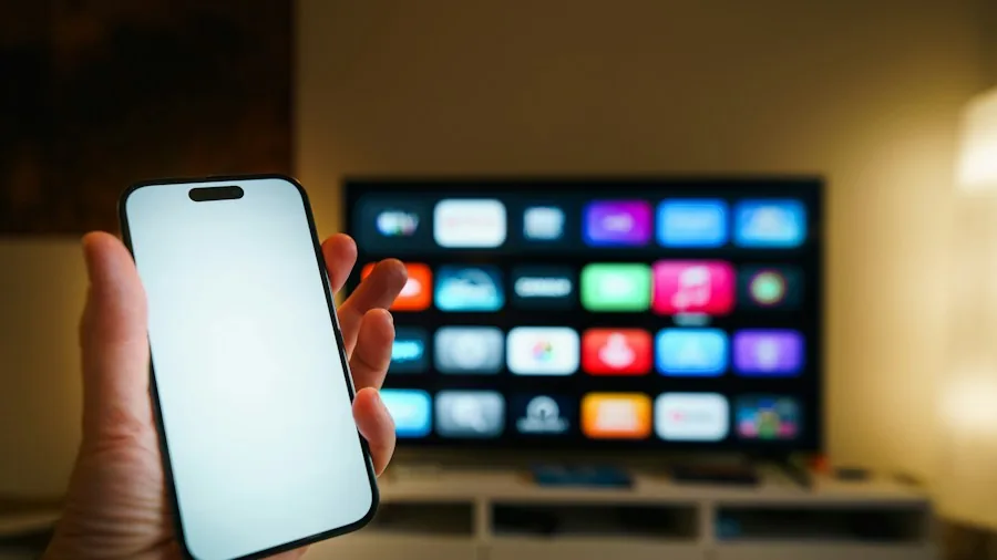 Person using smartphone to control home automation system in modern living room