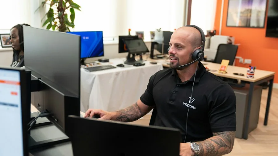 Professional customer service representative assisting a client with warranty information and support options